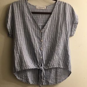 Button up high in the front long in the back